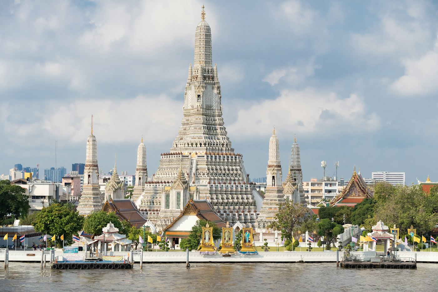 Wat Arun and its central prang on the Chao Phraya river in Bangkok