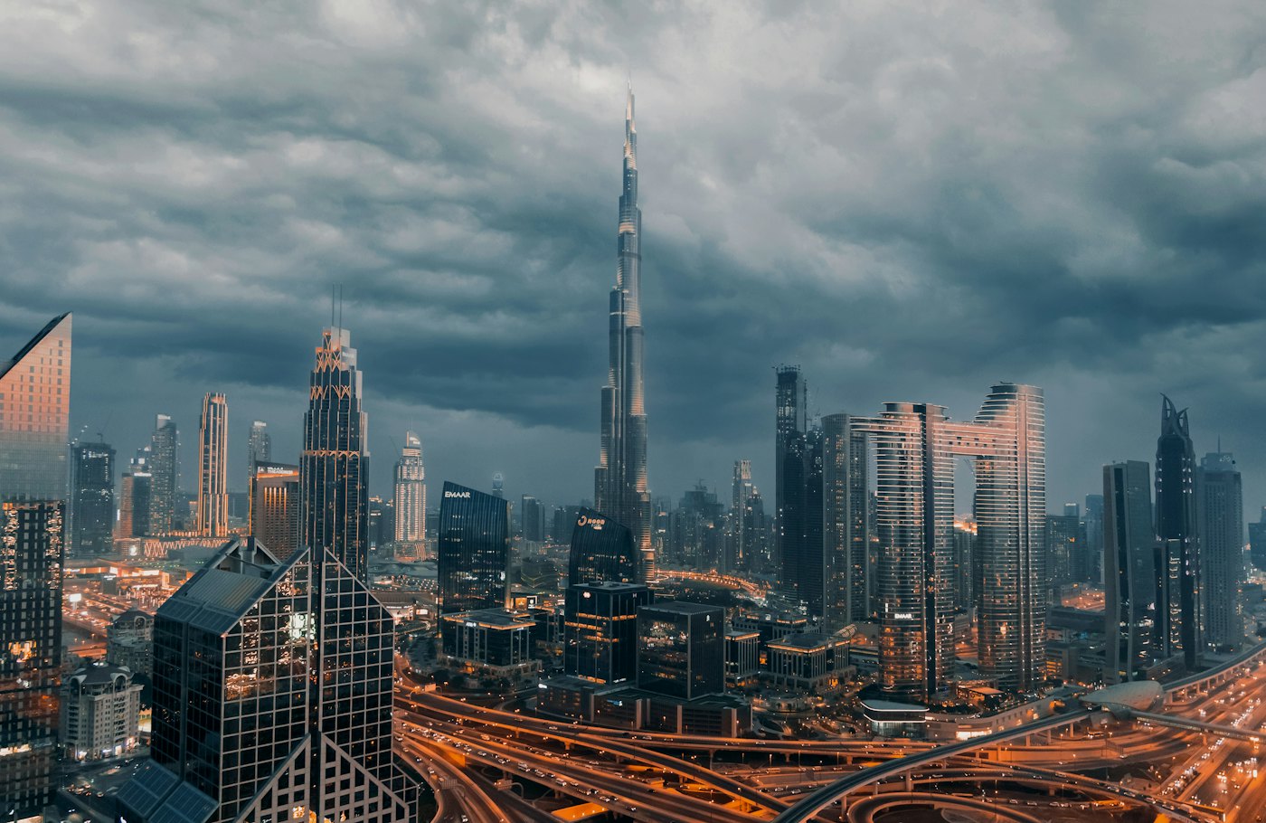 The Burj Khalifa rising over the lit Downtown Dubai skyline at dusk
