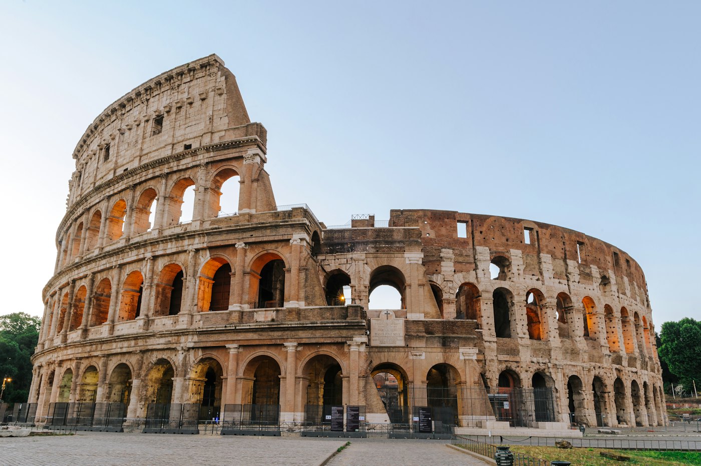 The Colosseum in Rome under early golden-hour light